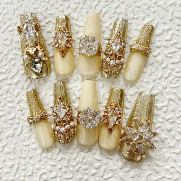 Luxury gold manicure, swirling Swarovski